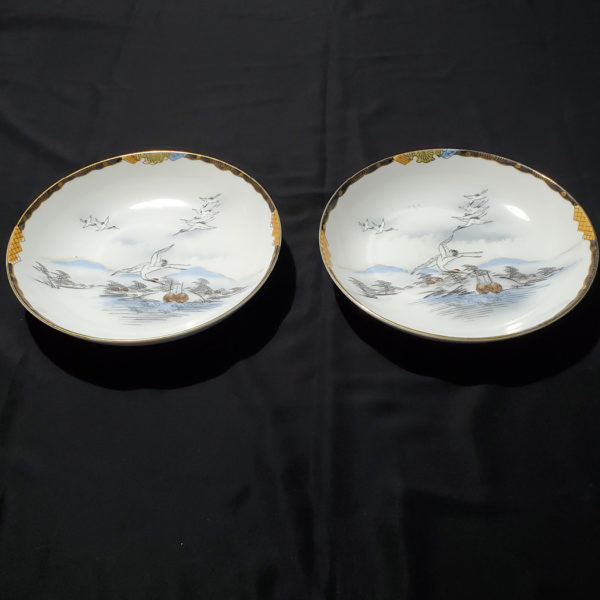 Pair of Japanese porcelain bowls hand painted with herons Nichi hon Nippon 1920s