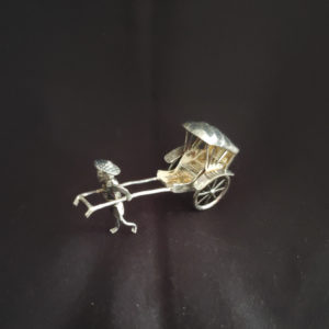 Vintage silver rickshaw in box with glass lid