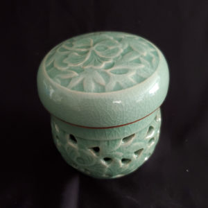Korean double paned celadon teacup with tea infuser and lid